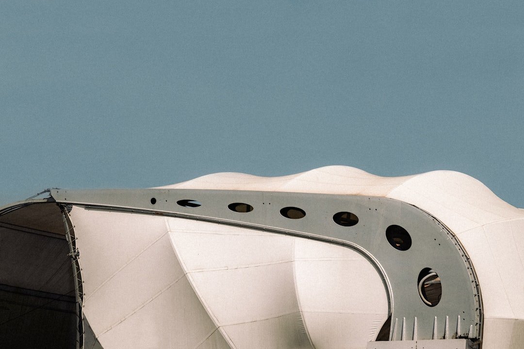 Aluminum soft jaws machined to hold a complex curved aerospace component in a CNC vise